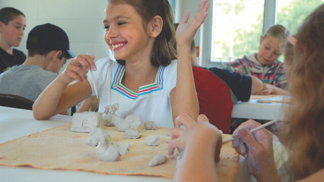 “BASICALLY, I TAKE A LUMP OF CLAY AND cut off anything that’s not a unicorn.” Eau Claire’s Parks and Recreation department offers more than a dozen visual art classes in summer like this clay class in Boyd Park.