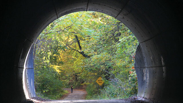 ENTER IF YOU DARE ... TO SEE SOME GORGEOUS WOODLAND TRAILS, HIDDEN AWAY RIGHT IN THE HEART OF EAU CLAIRE. The “big tunnel” under the State Street hill is just one of the wonders you’ll witness while walking along the gravely road that is Putnam Trail.