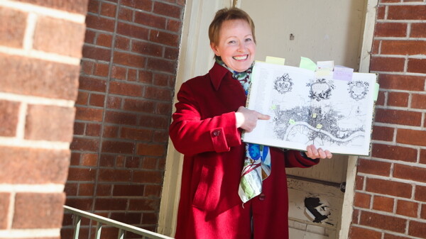 Local writer Delaney Green shows off a map of Old London, a setting for her Jem: A Girl of London series of novels.