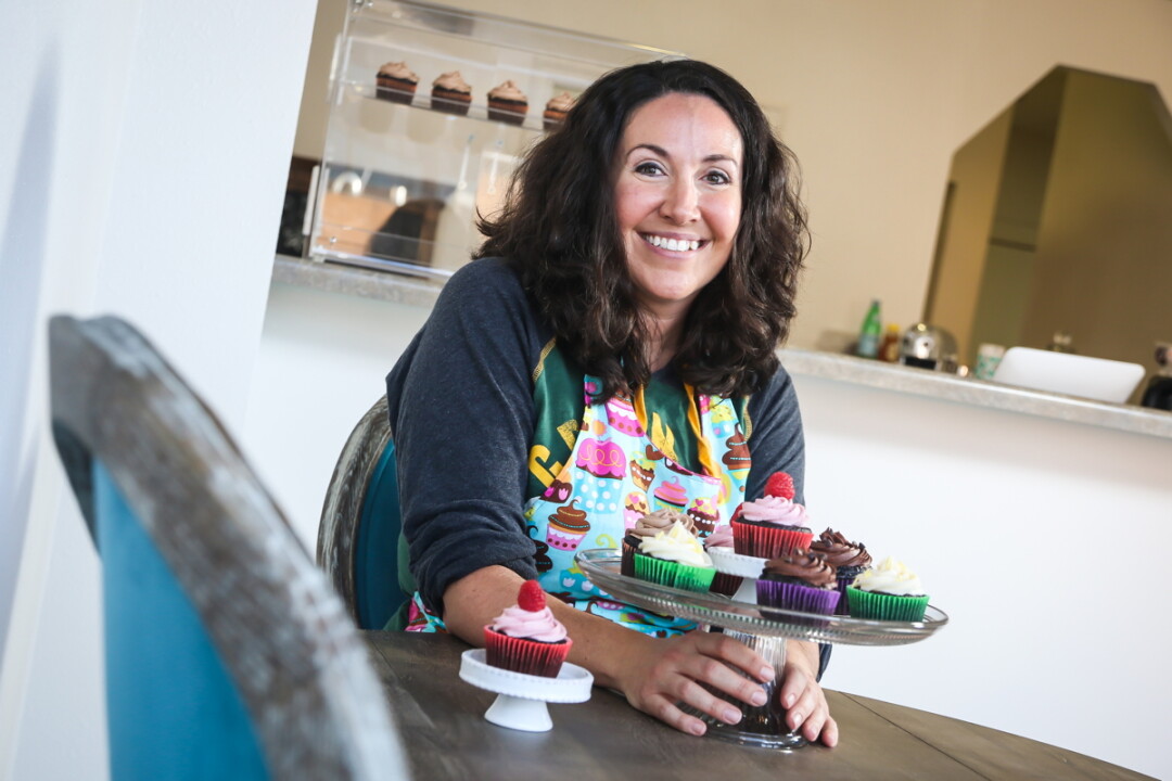 SWEET SMILES. Liz Zea, proprietor of the new Butter B Bakery, and some of her fantastic frosted creations.