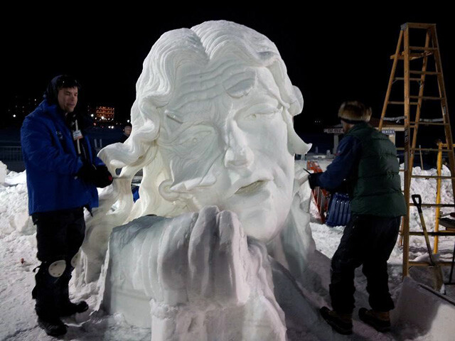 STARVIN’ FOR SOMETHING TO CARVE. The Starvin’ Carvists whittle down huge snow chunks into winter art.