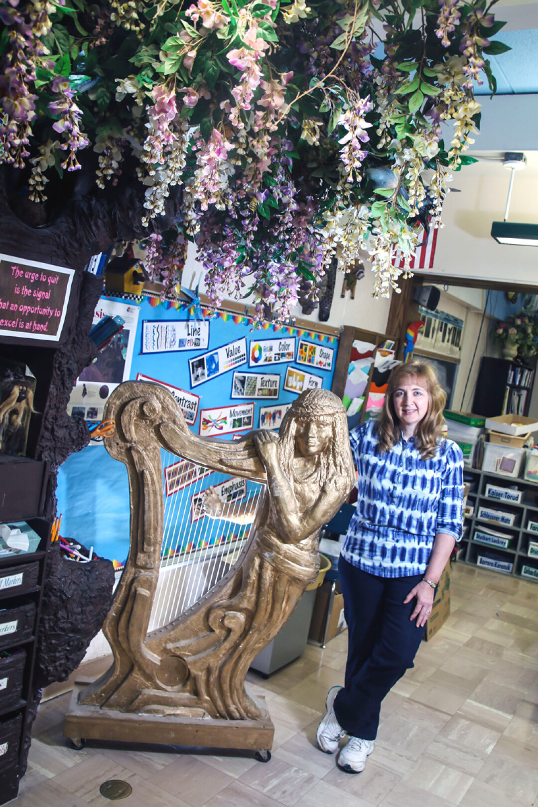 PULLING THE RIGHT STRINGS. Donna Walther of Pederson Elementary in Altoona has been known for decorating her classroom with large-scale pieces of art, including a harp that magically plays when students work hard.