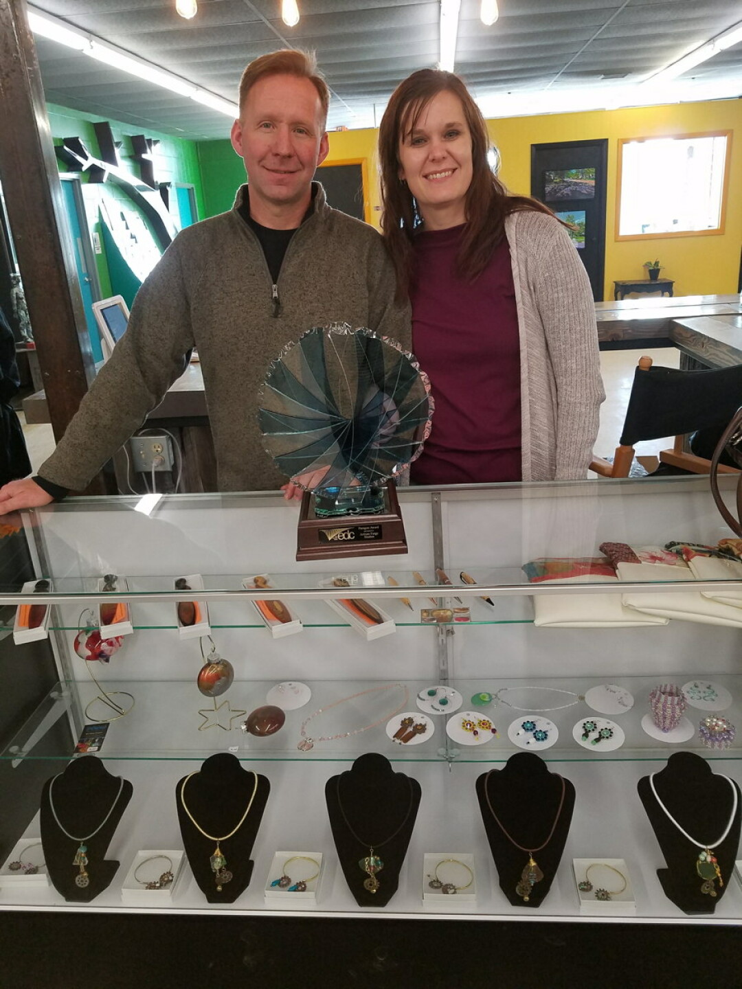 artisan forge founder greg johnson and his wife, krista, pose with the paragon award.