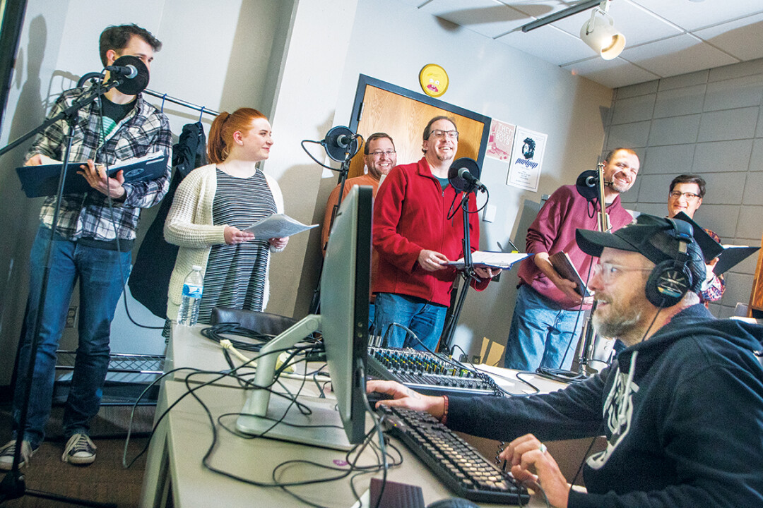 ATTACKING THE TRACKS. Above: Cast members of Bend in the River record dialogue at the Blugold Radio studios in UWEC’s McIntyre Library.