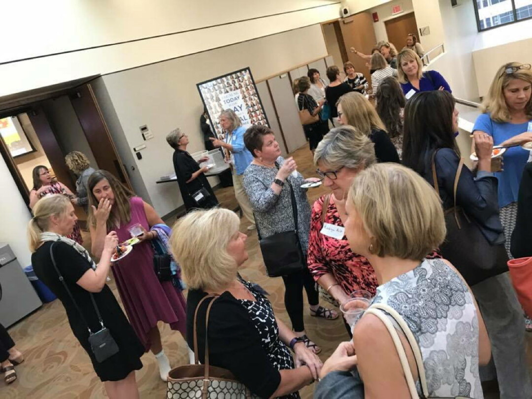 GATHERING OF GIVERS. Members of the 100+ Women Who Care chapter in Madison gather for a meeting.  A chapter of the international philanthropic organization is forming in the Chippewa Valley. 