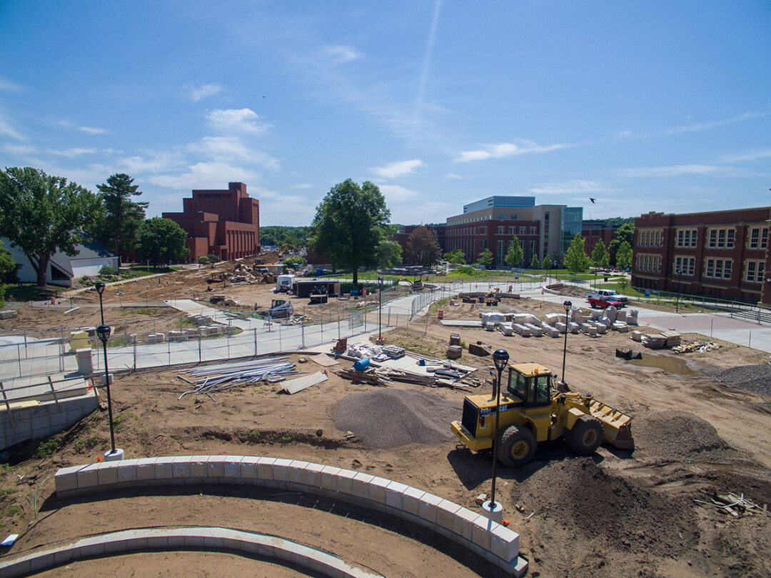 THE BIG DIG. Construction is ongoing this summer along Garfield Avenue on the UW-Eau Claire campus. The footbridge over the Chippewa River is at left.