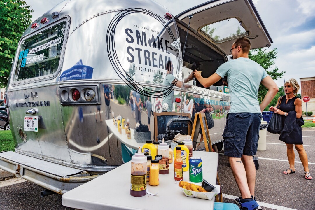 A SHINY SNACKMOBILE. Smokestream gleams even on overcast days as it serves up tacos, hot dogs, and mac’n’cheese to hungry patrons.