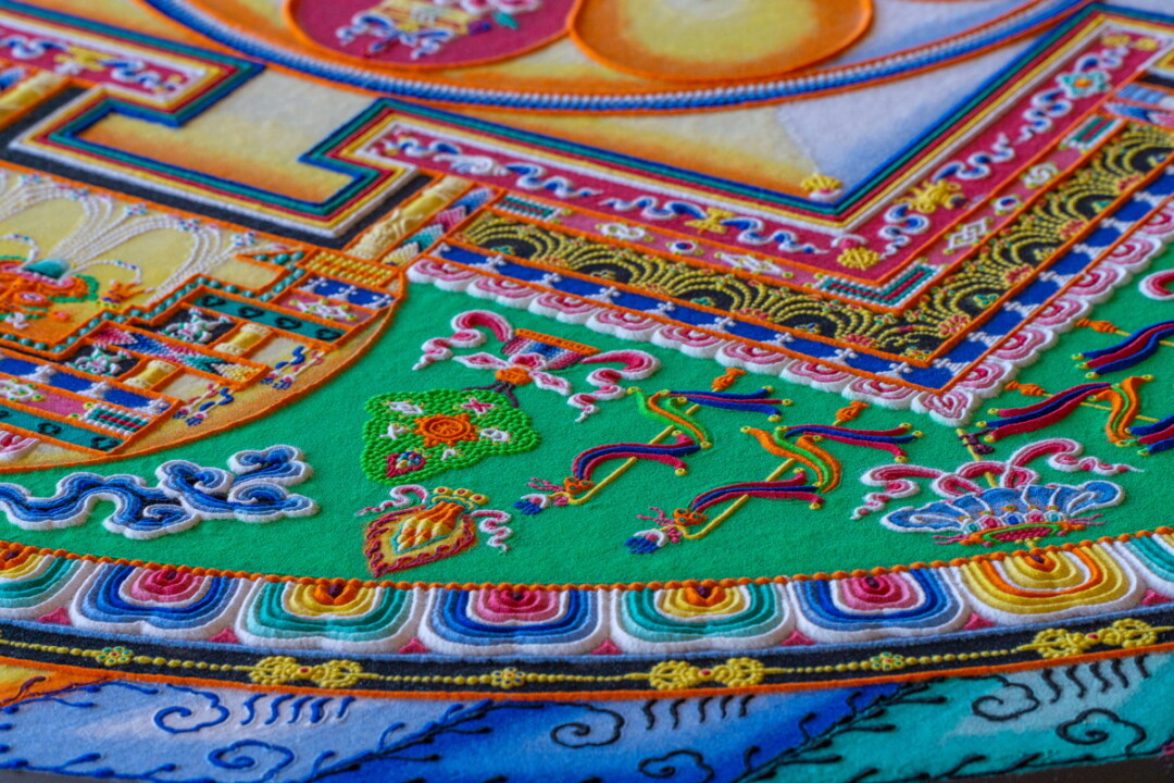 HANDY AND SANDY. The monks of the Drepung Loseling Monastery visited UW-Eau Claire from March 11-15 for an artist residency that included handcrafting an intricate sand mandala (above), lectures on Tibetan culture, traditions and beliefs, and a sacred music and dance performance.