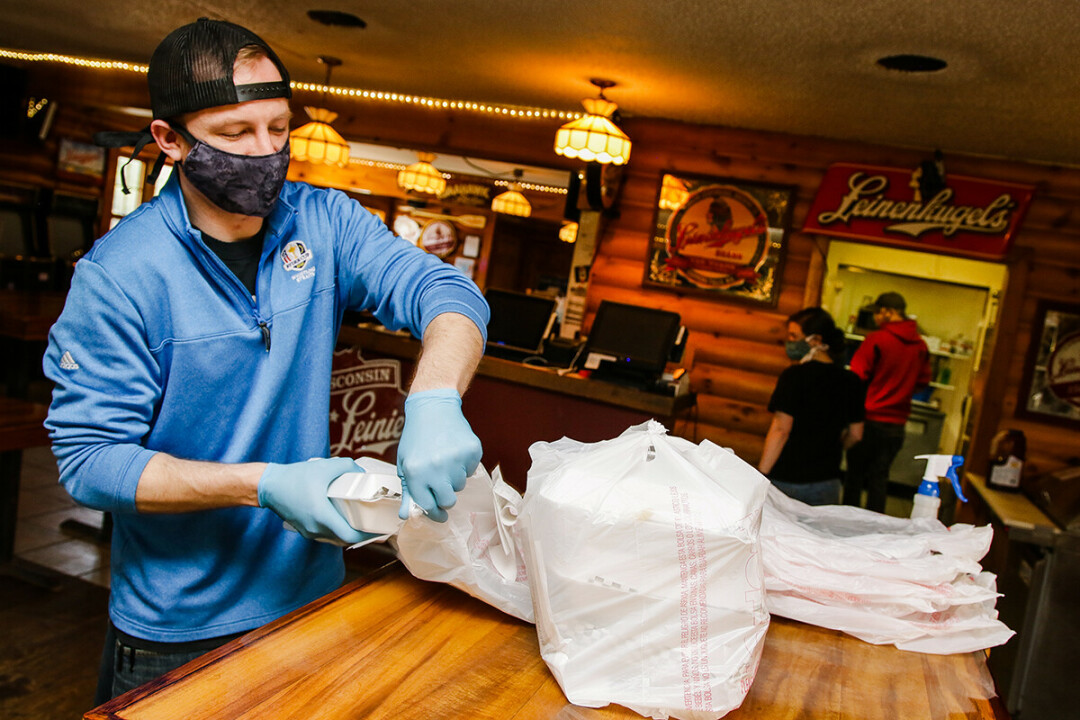MASK TASK. Restaurants, like Loopy’s in Chippewa Falls, have had to adapt quickly to the pandemic. 