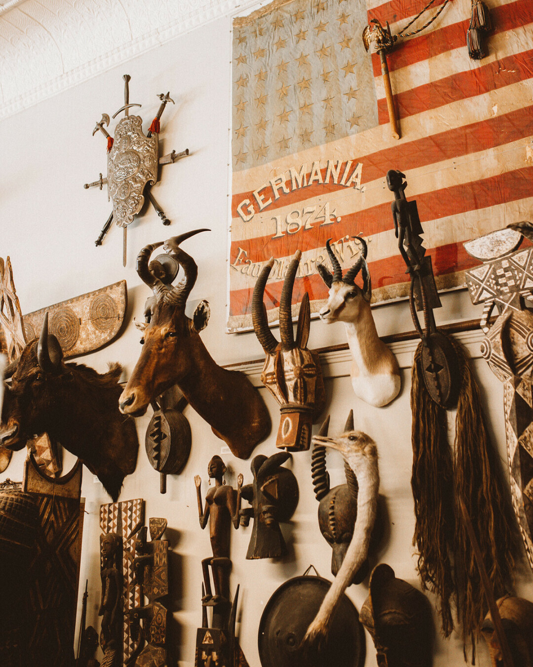 Among the countless curiosities in the Antique Emporium are taxidermied animal heads and a flag carried by a German-American regiment from Eau Claire in the Civil War. (Submitted photo)