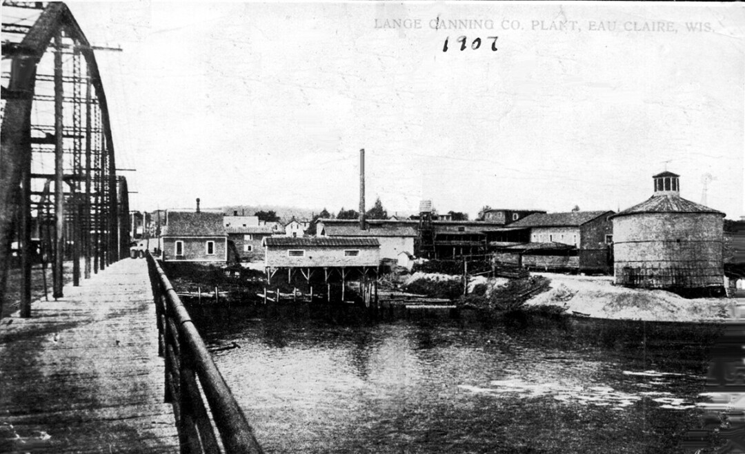 The Yellowstone Trail crossed the Chippewa River on the Madison Street bridge, shown at left in this 1907 image that includes what is now called the Cannery District at right. (Submitted photo)