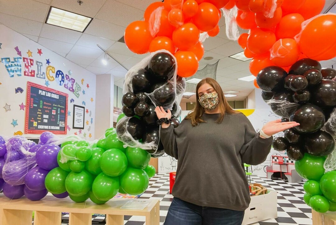 WHAT'S POPPIN'? Don't mind Lindsey Mueller, she's just making these ornate balloon arches and displays, perfect for any party. (Photo via Facebook)