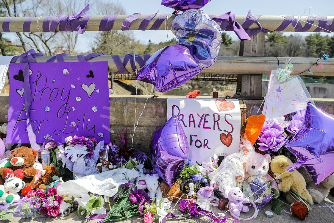 A COMMUNITY IN MOURNING. Well-wishers created a tribute on Jefferson Avenue in Chippewa Falls to 10-year-old Lily Peters, who was found dead nearby on Monday, April 25. A juvenile suspect in her death was arrested the following day, and is being held on  $1 million bail.