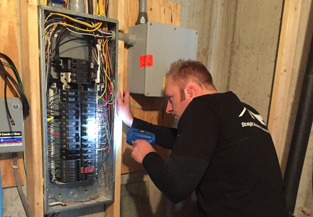 Home inspector Ryan Stewart examines an electrical box. (Submitted photo)