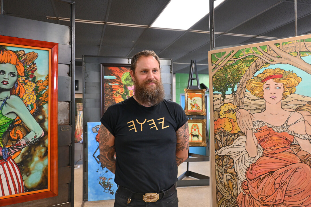 SKIN OR PAPER? Artist Jonah Lemke has been tattooing in Eau Claire for 20 years, but is now showing off his other art.