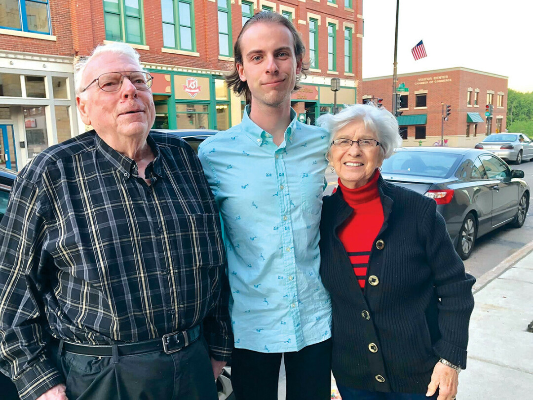 Writer and musician Parker Reed, center, with his grandparents, Roland and Patricia Bushland, 