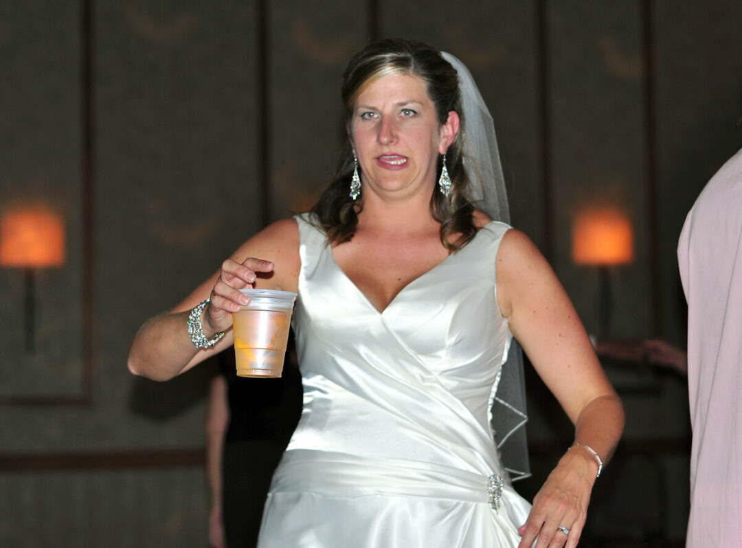 A bride with a beer? It must be a Wisconsin wedding! (Photo by 