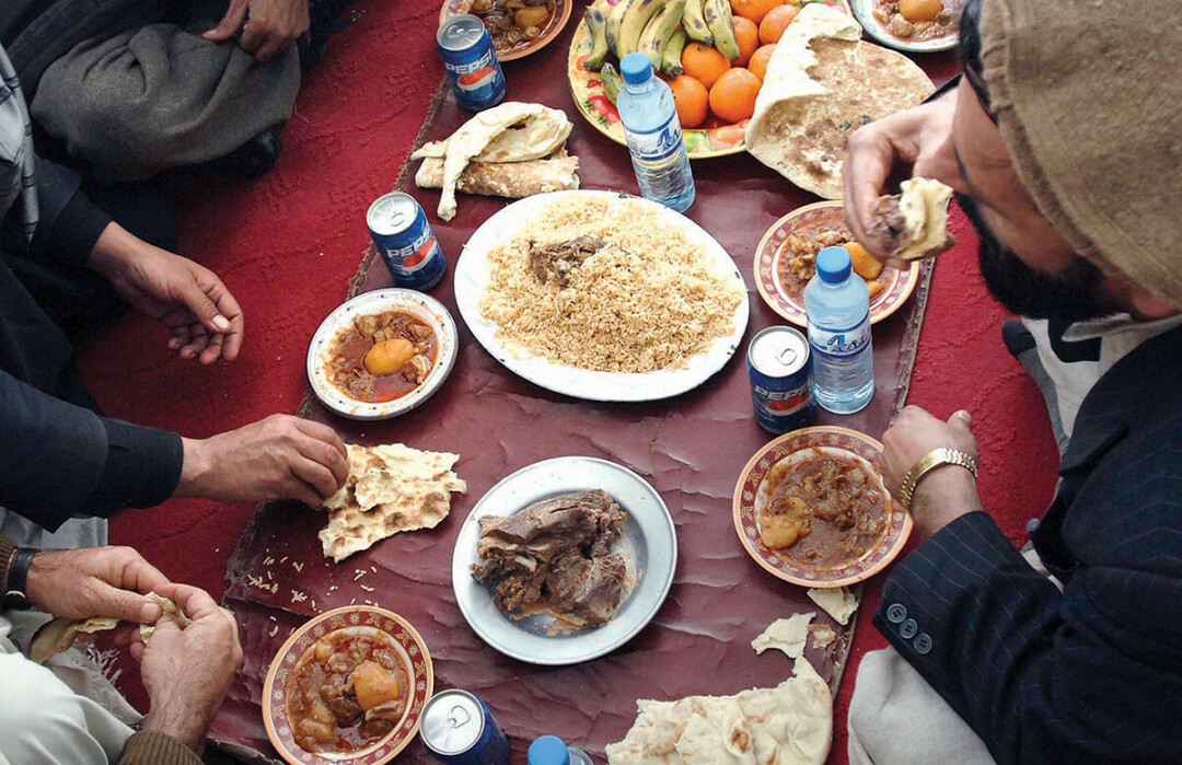 After Paktia provincial officials spoke at a meeting with tribal officials and locals of the Jani Khel district Feb. 15, 2009, local citizens served a traditional Afghan feast that included beef, chicken, lamb, rice and bread.