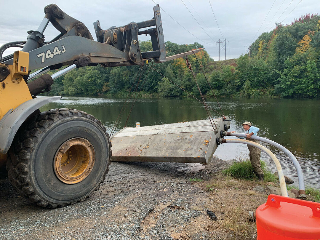 PUTTING IT TO BED. A device was temporarily installed in the Eau Claire River in September to see if it would keep sand from reaching Lake Altoona.