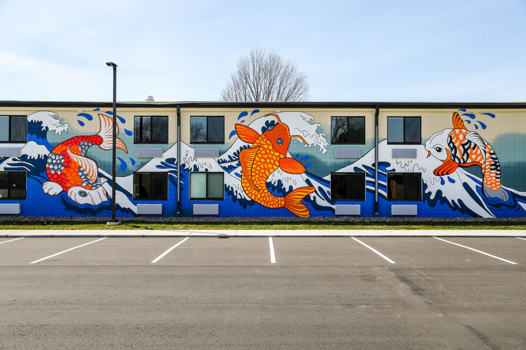 JUST KEEP SWIMMING. The largest mural in Eau Claire, named the 