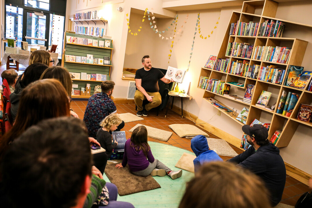 MAKE A WISH. Author Jonathan Hillman (pictured) reads his new children’s book, The Wishing Machine, to a group of kiddos at Dotters Books in Eau Claire.