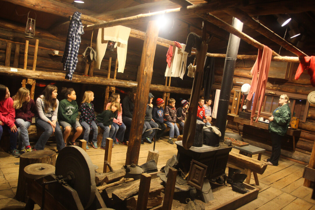  A SCHOOL TOUR GROUP VISITED THE REPLICA BUNKHOUSE AT THE PAUL BUNYAN LOGGING CAMP MUSEUM IN CARSON PARK LAST SPRING. about 4,000 students visit the museum annually.