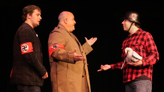 why are two nazis talking to that lumberjack and his pet bird? because it’s musical theatre, duh. Chippewa Valley Theatre Guild players in a rehearsal of The Producers.