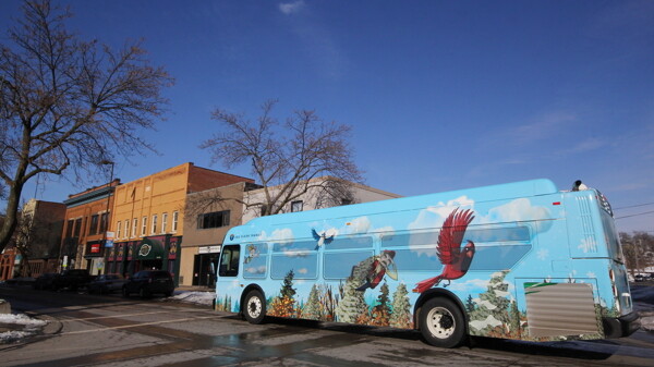 YES, THE WHEELS REALLY DO GO ’ROUND AND ’ROUND. In February Eau Claire Transit unveiled three mural-wrapped buses, including this one.