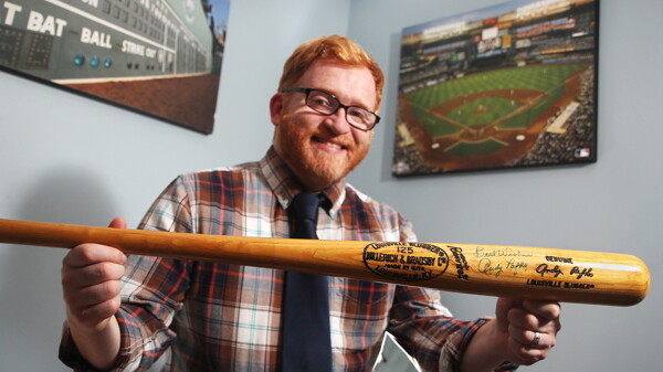 ANOTHER SWING. Author Joe Niese shows off a bat autographed by Wisconsin-born slugger Andy Pafko, the subject of Niese’s latest baseball biography. Pafko played for the Cubs, Dodgers, and Braves.