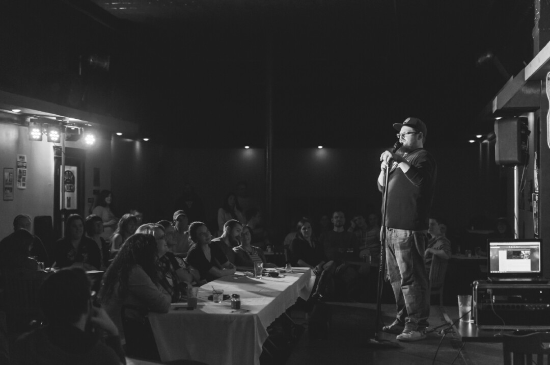 PACKED HOUSE | Local comic Justin Schenck throws his short-n-sweet style of joke writing at a sold-out Thursday crowd, opening for John Conroy, a handpicked touring comic from Washington D.C.