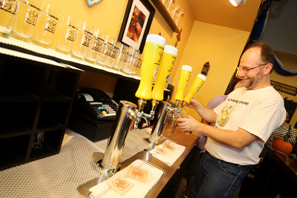 POUR SOME MORE! Lazy Monk owner Leos Frank pours a specialty brew at their Oktoberfest celebration.