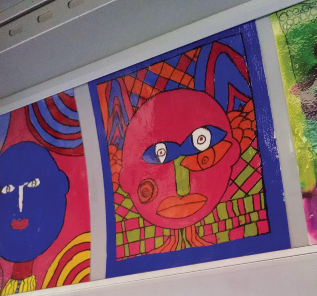 THE ART ON THE BUS GOES ROUND AND ROUND. A new collection of kids’ art will grace the interior of EC buses.