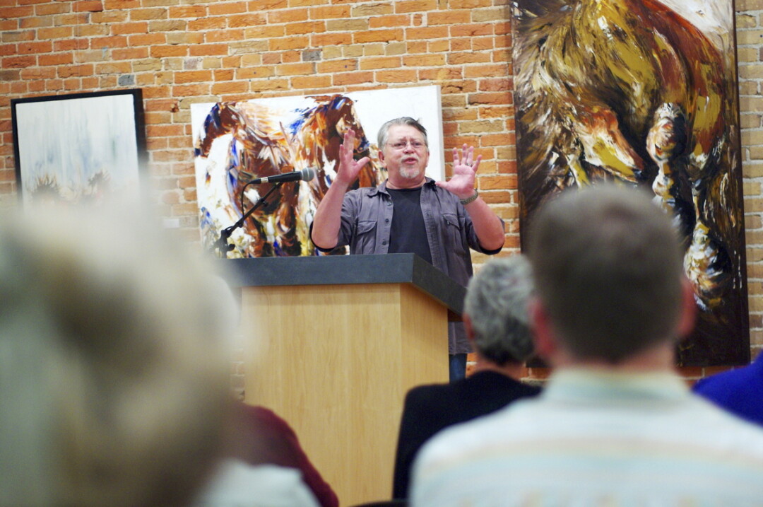 POETRY IN MOTION. As the City of Eau Claire’s poet laureate, Bruce Taylor has organized scores of readings, including this one at the Volume One Gallery, over the past five years.