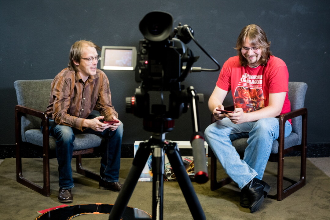 LET’S PLAY. Olaf Lind (left) and Wyatt Biegel record an episode of Community Gaming at Chippewa Valley Community Television. The show covers console and computer games, apps, tabletop games, and more.