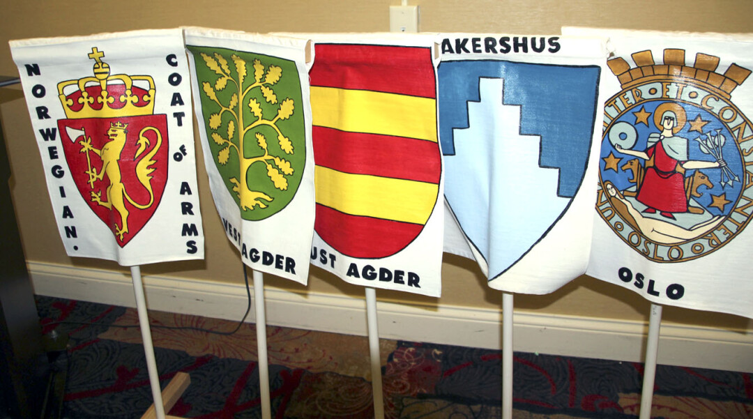 MAI OH MAI. Coats of arms of Norway and its regions are displayed at the annual Syttende Mai banquet.