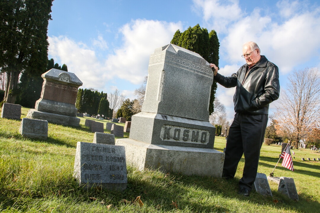FAMILY HISTORY. Author and Eau Claire native Jim Kosmo visits the family plot at the Northside Lutheran Cemetery on Omaha Street, a location featured in his new book, Monsters in the Hallway.