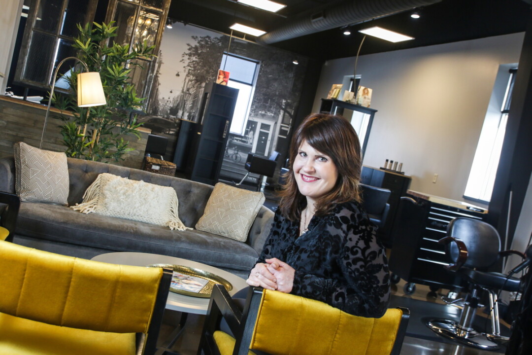 SITTING IN STYLE. Janelle Buesser recently opened Watermark Salon inside Eau Claire’s Artisan Forge Studios.
