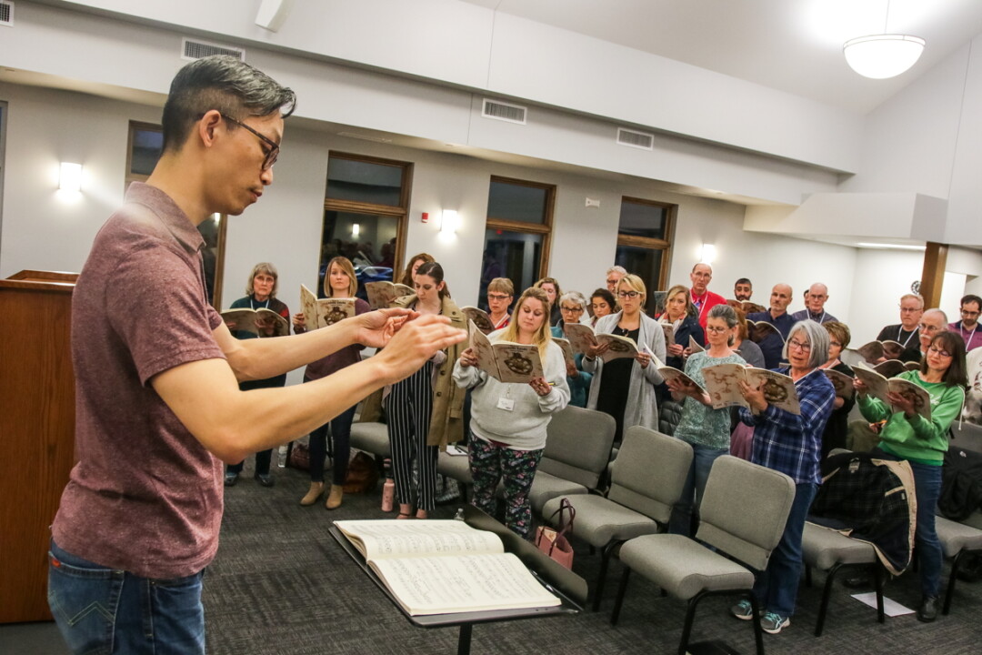 ALL TOGETHER NOW. Jerry Hui, an assistant professor of music at UW-Stout, directs the newly formed Chippewa Valley Festival Choir, which will perform May 18.