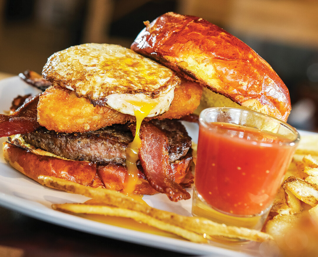 YOU’LL HAVE A DEVIL OF A TIME. Diablo Blue, a new eating and drinking establishment in downtown Menomonie, offers savory options such as Mike’s Morning After Burger (above) and a cilantro-lime crusted shrimp bowl (right).