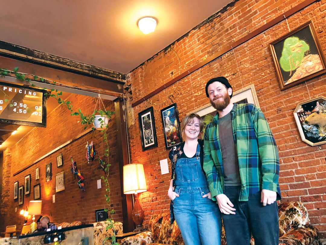 WALL THE POTENTIAL IN THE WORLD. Artfly curators Kelsey Wenberg (left) and Josh Treankler established a gallery at Racy’s in Eau Claire along with casual art talks.