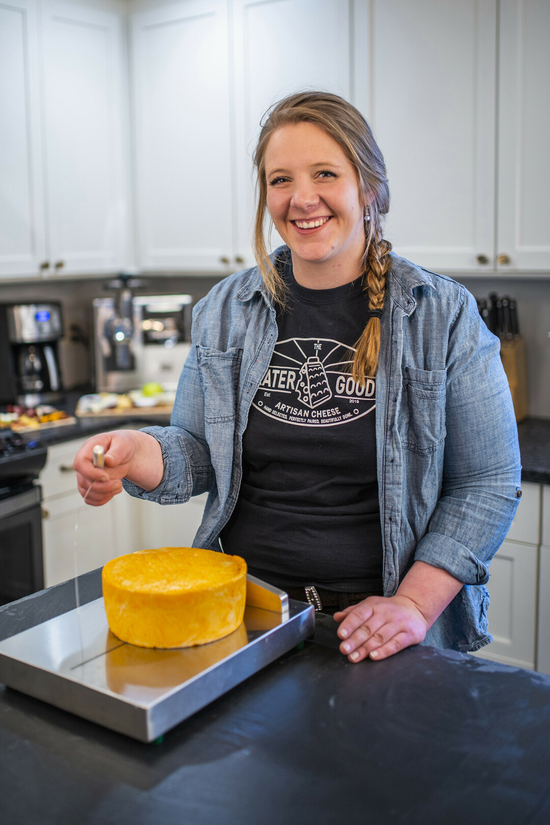 IT'S WHEEL-Y GOOD STUFF. UW-Stout alumna Christine Leonard has her own cheese platter business the Grater Good offering locally produced products. She also offers classes teaching about different cheeses. / Photo courtesy Christine Leonard and Maria Claire Photography