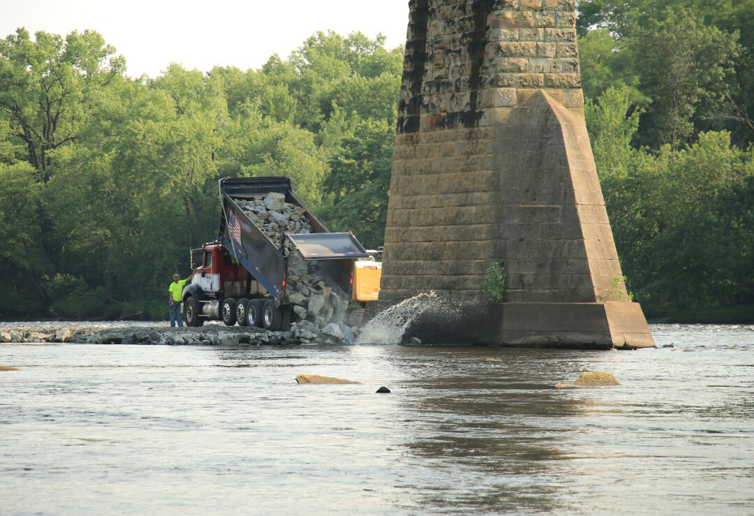 A causeway it built into the Chippewa River to reach the bridge's pilings in the summer of 2021. (Photo by Tina Ecker)