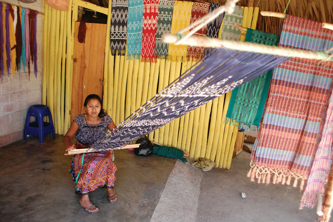 Guatemalan artisan creating textiles for Fair Anita, one of many vendors at this year's Eau Claire Global Market