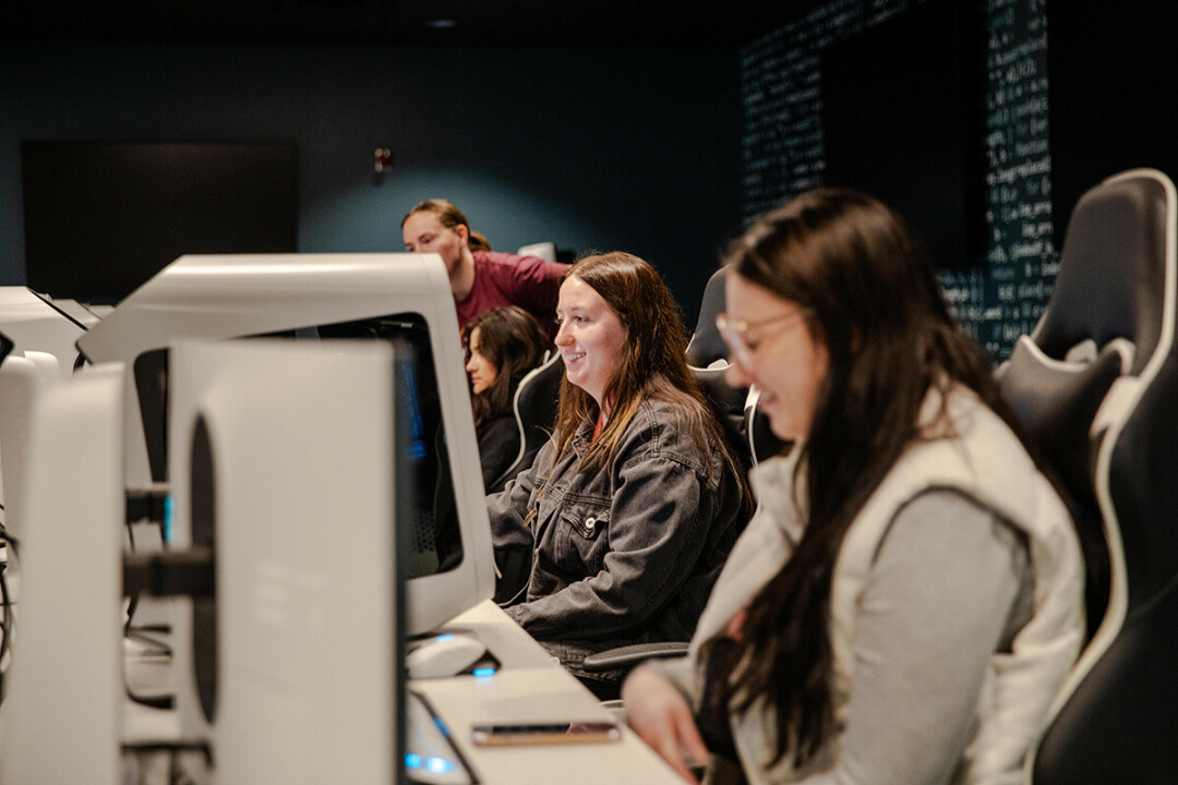 Amanda Preston, center, nursing student at Chippewa Valley Technical College, logs into a game for the first time in the College’s new lab that also will be used for cybersecurity education. Preston and her fellow nursing student friends, Lacey Casalegno, foreground, and Mattie Dickerson, background, are researching gaming and mental health. 