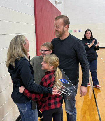 Kjelstad is congratulated by her family.
