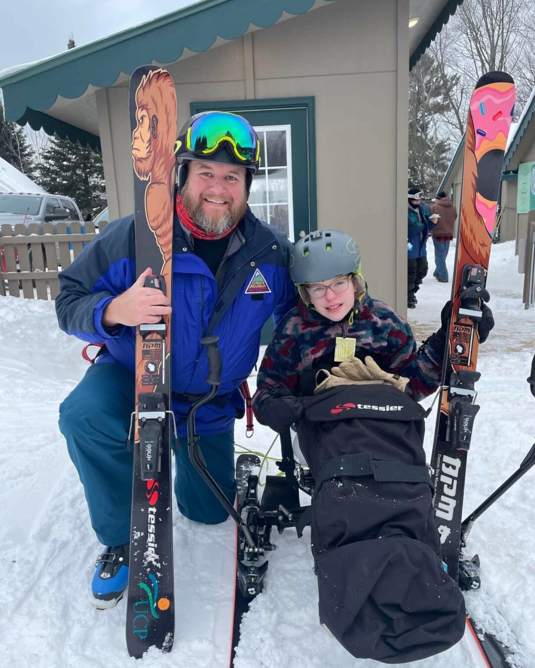 Chris and his daughter with his BPM skis.