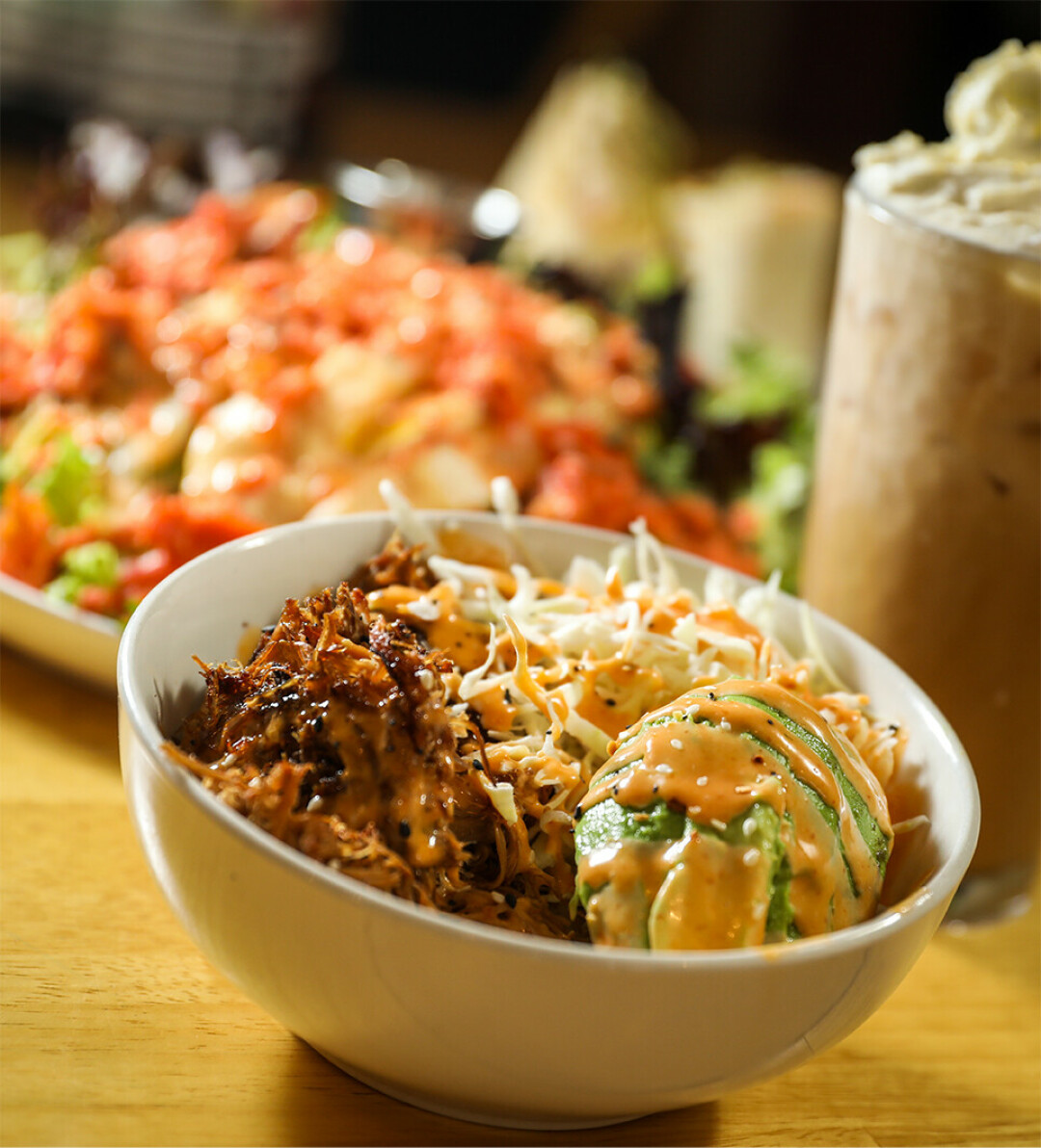 Rice Bowl: Sailer's pulled pork, rice, cabbage, avocado, and honey sriracha aioli.