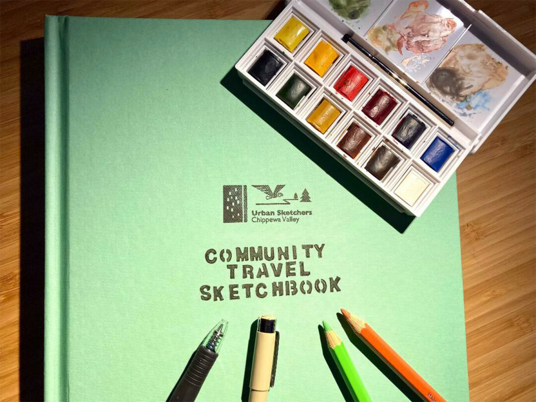 PUTTING PEN TO PAPER. The Urban Sketchers Chippewa Valley group launched a new community sketchbook, now available for folks to take a whack at. (Photos via Facebook)