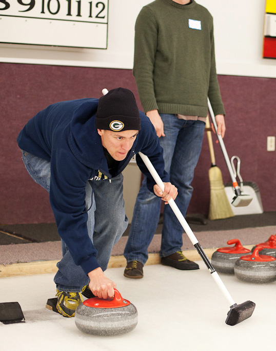 An Eau Claire Curling Club member prepares to throw. Photo by Zach Oliphant