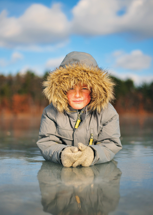 WISCONSIN ESKIMO. V1 photographer Tim Mather caught this shot of his son Heinz out on the ice of Lake Menomin in Menomonie while ice skating earlier this winter.